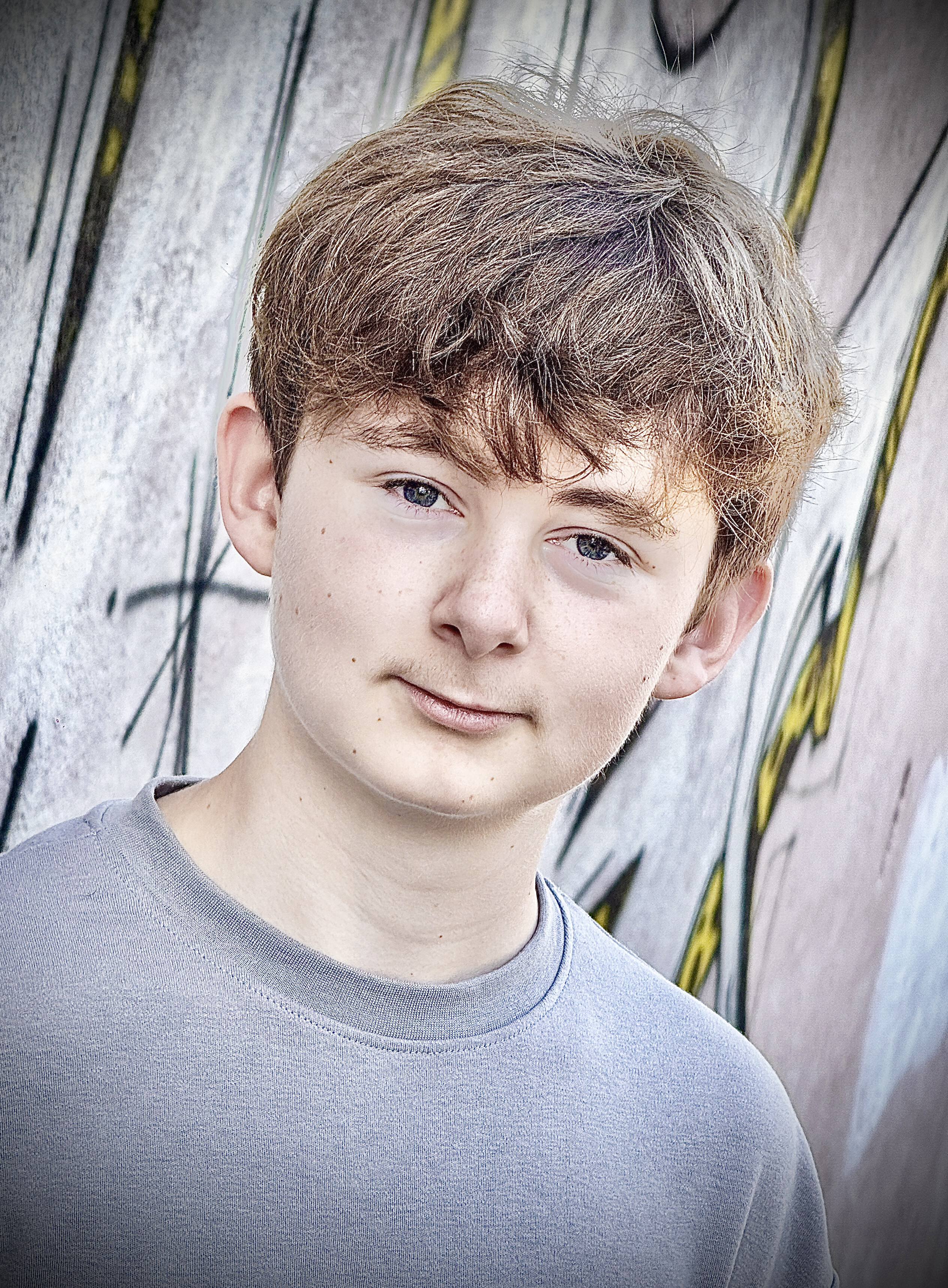 DJ Zac Harris Newcastle DJ promotional headshot in front of a wall of grafiti in Rome